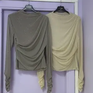 Maglia con polsino velata e brillantinata